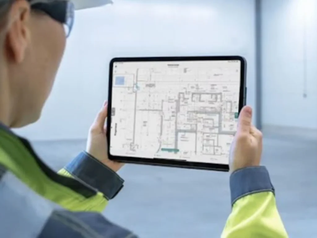 Close-up of engineer using handheld 3D laser scanner to capture detailed structural measurements